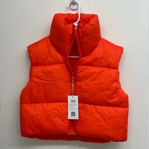 Ladies orange puffer vest. NWT